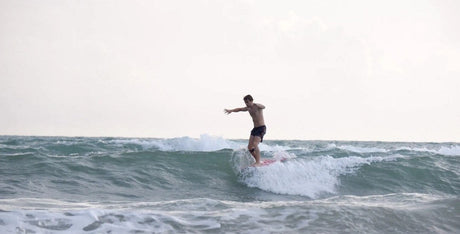 Surfing at SUNOVA Beach